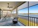 Spacious screened balcony with lake view and dining furniture at 23471 Awabuki Dr, Venice, FL 34293
