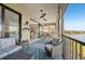 Large screened balcony with outdoor furniture and lake view at 23471 Awabuki Dr, Venice, FL 34293