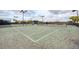Well-maintained tennis courts with ample seating at 23471 Awabuki Dr, Venice, FL 34293