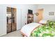 Bedroom with sliding glass doors leading to the living room at 237 Southampton Ln # 275, Venice, FL 34293