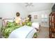 Bright bedroom with twin beds, tropical bedding, and window shutters at 237 Southampton Ln # 275, Venice, FL 34293