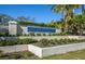 Myrtle Trace community entrance with landscaping at 237 Southampton Ln # 275, Venice, FL 34293