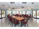 Community room with tables, chairs, and large windows at 237 Southampton Ln # 275, Venice, FL 34293