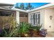 Private courtyard with lush landscaping and lattice screen at 237 Southampton Ln # 275, Venice, FL 34293