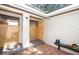 Private courtyard access with brick pavers and wood lattice at 237 Southampton Ln # 275, Venice, FL 34293