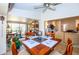 Bright dining room with a wooden table set and view to the living room at 237 Southampton Ln # 275, Venice, FL 34293