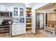 Updated kitchen with white cabinets, stainless steel appliances, and ample storage at 237 Southampton Ln # 275, Venice, FL 34293