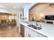 Modern kitchen with a double sink, stainless steel appliances, and white cabinets at 237 Southampton Ln # 275, Venice, FL 34293