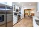 Modern kitchen with stainless steel appliances and white shaker cabinets at 237 Southampton Ln # 275, Venice, FL 34293