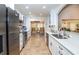 Modern kitchen with stainless steel appliances and a view of the breakfast nook at 237 Southampton Ln # 275, Venice, FL 34293