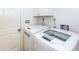 Laundry room with side-by-side washer and dryer at 237 Southampton Ln # 275, Venice, FL 34293