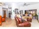 Open living room and kitchen with neutral colors and a comfortable seating area at 237 Southampton Ln # 275, Venice, FL 34293