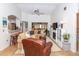 Bright living room with vaulted ceiling, comfortable seating, and a fireplace at 237 Southampton Ln # 275, Venice, FL 34293