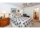Main bedroom with a double bed, dresser, and an ensuite bathroom at 237 Southampton Ln # 275, Venice, FL 34293