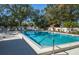 Community pool with plenty of lounge chairs at 237 Southampton Ln # 275, Venice, FL 34293