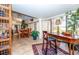 Sunroom features a desk, seating area, and access to the backyard at 237 Southampton Ln # 275, Venice, FL 34293