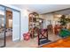 Spacious sunroom with multiple seating areas, a view of the bedroom, and access to backyard at 237 Southampton Ln # 275, Venice, FL 34293