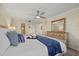Bright bedroom with comfortable bed and dresser at 255 The Esplanade N # 202, Venice, FL 34285