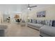 Open living space with kitchen views and comfortable seating at 255 The Esplanade N # 202, Venice, FL 34285
