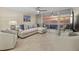 Spacious living area showcasing sunset views and comfortable seating at 255 The Esplanade N # 202, Venice, FL 34285