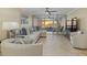 Living room boasting sunset ocean views and comfortable furniture at 255 The Esplanade N # 202, Venice, FL 34285