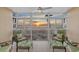Relaxing sunroom boasts stunning sunset views and comfortable seating at 255 The Esplanade N # 202, Venice, FL 34285