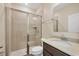 Modern bathroom featuring a sleek glass enclosed shower and granite vanity at 2737 Cottage Ln, North Port, FL 34286