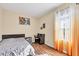 Neutral bedroom featuring a hard wood floor and bright, natural light at 2737 Cottage Ln, North Port, FL 34286