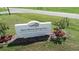 Warm Mineral Springs Park community sign surrounded by flowerbeds at 2737 Cottage Ln, North Port, FL 34286