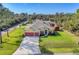 Charming single Gathering home features a sprawling front lawn and ample parking at 2737 Cottage Ln, North Port, FL 34286