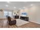 Bright living room with hardwood floors, natural light, and neutral wall color at 2737 Cottage Ln, North Port, FL 34286