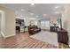 Spacious living room boasts hardwood floors, recessed lighting, and open floor plan at 2737 Cottage Ln, North Port, FL 34286