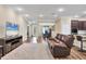 Open floor plan with seamless flow from living room to kitchen and dining area at 2737 Cottage Ln, North Port, FL 34286