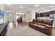 Open floor plan seamlessly connects the living room to kitchen and dining area at 2737 Cottage Ln, North Port, FL 34286