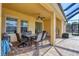 Covered patio with a dining table and a view of the backyard at 2737 Cottage Ln, North Port, FL 34286