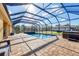 This backyard boasts a private screened-in pool and hot tub for outdoor relaxation at 2737 Cottage Ln, North Port, FL 34286