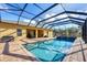 Relax by the pool, surrounded by a screened enclosure and a spacious outdoor area at 2737 Cottage Ln, North Port, FL 34286