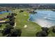 Aerial view of golf course with lake and residential area at 298 Montelluna Dr, North Venice, FL 34275