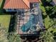 Aerial view of a home with a screened pool and spa at 298 Montelluna Dr, North Venice, FL 34275