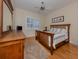 Charming bedroom with wood furniture and a view of the golf course at 298 Montelluna Dr, North Venice, FL 34275