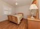 Bright bedroom with wood floors and a double bed at 298 Montelluna Dr, North Venice, FL 34275