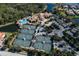 Aerial view of community tennis courts, pool, and clubhouse at 298 Montelluna Dr, North Venice, FL 34275