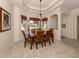 Bright dining room featuring a wood table and six chairs at 298 Montelluna Dr, North Venice, FL 34275