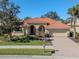 Single-Gathering home with tile roof and landscaped yard at 298 Montelluna Dr, North Venice, FL 34275