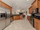 Modern kitchen with stainless steel appliances and ample cabinet space at 298 Montelluna Dr, North Venice, FL 34275