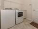 Laundry room with washer, dryer, and built-in cabinets at 298 Montelluna Dr, North Venice, FL 34275