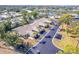 Aerial view of the home in a beautiful community with a lake in the background at 301 Pinebrook Club Dr # 1, Venice, FL 34285