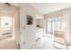 Bright bathroom with a doorway to a bedroom, natural light and a clean design at 301 Pinebrook Club Dr # 1, Venice, FL 34285