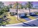 Charming one-story home featuring an attached garage, mature landscaping, and a well-maintained lawn at 301 Pinebrook Club Dr # 1, Venice, FL 34285