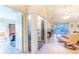 Bright hallway with atrium and doorway leading to the open living area at 301 Pinebrook Club Dr # 1, Venice, FL 34285